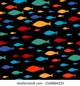 Colorful fish flock on black background seamless pattern. School of fish swiming in one direction. Vector illustration.