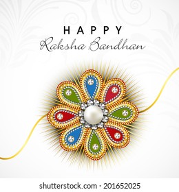 Colorful floral decorated rakhi on floral decorated grey background for the festival of Raksha Bandhan celebrations. 