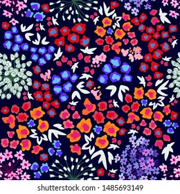 	
Colorful floral field. Trendy fabric pattern with miniature wildflowers on black background. Botanical seamless print with different  elements. Vintage textile collection.