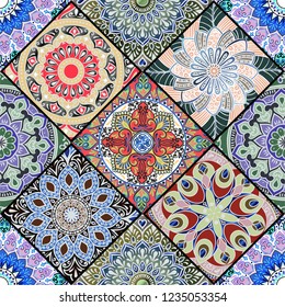 Colorful floral seamless pattern from different rhombus with mandala in patchwork boho chic style, in portuguese and moroccan motif