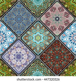 Colorful floral seamless pattern from different squares with mandala in patchwork boho chic style, in portuguese and moroccan motif