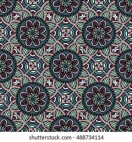 Colorful floral seamless pattern from different rhombus with mandala in patchwork boho chic style, in portuguese and moroccan motif. Hand drawn vector stock illustration