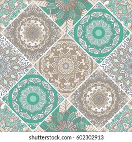 Colorful floral seamless pattern from different rhombus with mandala in patchwork boho chic style, in portuguese and moroccan motif