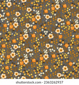Colorful floral vector seamless pattern, hand-drawn. Nostalgic fashion textiles in retro style on a dark background. Print with the image of light yellow, yellow and orange flowers.