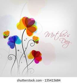 Colorful flowers with text Mothers Day on grey background.