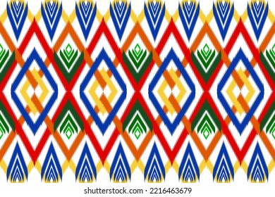 Colorful geometric ethnic seamless pattern ikat art embroidery style design for wallpaper, background, fabric, curtain, carpet, clothing, and wrapping.