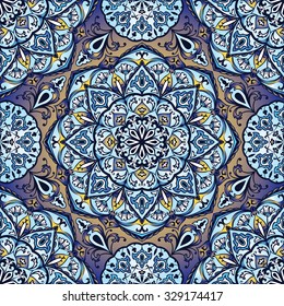 Colorful, glaze seamless pattern of mandalas. Vector oriental pattern on a bright blue tones. Fairy floral pattern of circular elements.Can be used for textiles, carpet, tile, shawl.