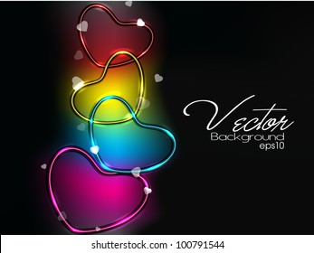 Colorful glossy an ahiny heart shapes on black background, can be use as banner, flyer or poster. EPS 10. Vector illustration.