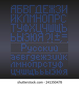 Colorful green LED display against dark background. Russian letters