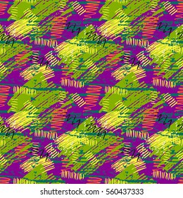 Colorful green, purple, yellow grunge seamless pattern with abstract hand drawn brush strokes and paint splashes. Messy infinity texture, modern grungy background. Vector illustration. 