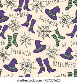 Colorful hand drawn vector halloween seamless pattern on the beige background. Includes purple with green witches hat, stockings, shoes and spider webs. 