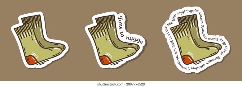Colorful hand-drawn cold days mood stickers set with wooly socks in doodle style and lettering isolated on white background. Cute vector collection for seasonal decoration.