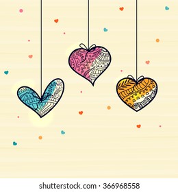 Colorful hanging floral design decorated hearts for Happy Valentine's Day celebration.