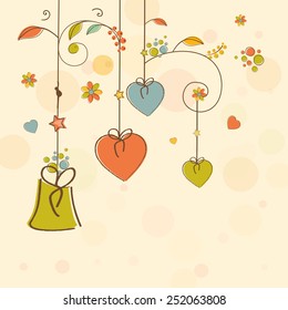Colorful hanging hearts and gift for Happy Valentine's Day celebration on decorated background.