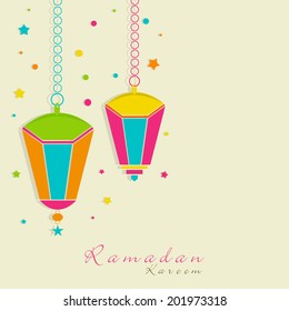 Colorful hanging lanterns on colorful dotted green background for holy month of Muslim community Ramadan Kareem. 