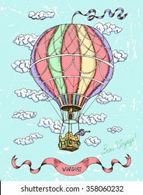 Colorful happy birthday card with hot air balloon, banner and clouds on blue scratched background. Doodle line art illustration with hand drawn design elements. Have a good trip text in French.