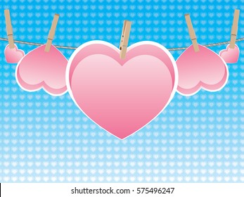 Colorful heart on a rope with wooden pegs.