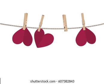 Colorful heart on a rope with wooden pegs.