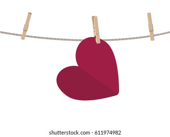 Colorful heart on a rope with wooden pegs.