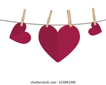 Colorful heart on a rope with wooden pegs.