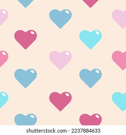 Colorful hearts on beige background seamless pattern
