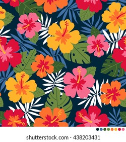 Colorful hibiscus and palm leaf seamless vector pattern.