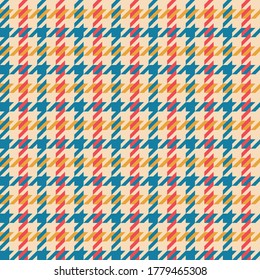 Colorful hounds tooth pattern vector in blue, red, yellow, beige. Seamless multicolored dog tooth check plaid for jacket, coat, skirt, or other modern spring and autumn textile print.