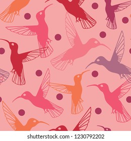 Colorful hummingbird  and dot pattern in pink, violet, red and orange. Lively spring seamless vector design with multicolor hummingbird silhouettes, perfect for textiles, invitations and fashion uses.