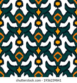 Colorful ikat pattern in vintage style. Elegant ethnic background. Hand drawn oriental art. Seamless geometric modern vintage texture.	