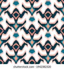 Colorful ikat pattern in vintage style. Elegant ethnic background. Hand drawn oriental art. Seamless geometric modern vintage texture.	