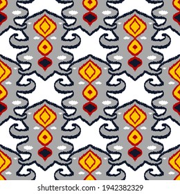 Colorful ikat pattern in vintage style. Elegant ethnic background. Hand drawn oriental art. Seamless geometric modern vintage texture.	
