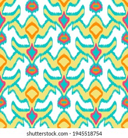 Colorful ikat pattern in vintage style. Elegant ethnic background. Hand drawn oriental art. Seamless geometric modern vintage texture.	