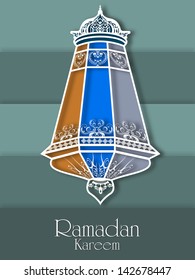 Colorful intricate Arabic Lamp on abstract green background for holy month of Muslim community Ramadan Kareem.