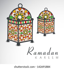Colorful Intricate Arabic lamps on grey background for holy month of Muslim community Ramadan Kareem.