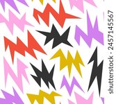 Colorful irregular spark and twinkle seamless pattern. Yellow, red, purple and black sharp shapes repeating background. Bright sharp edgy ornament wallpaper. Vector bright nursery repeated backdrop