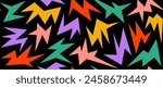 Colorful irregular spark and twinkle seamless pattern. Yellow, red, purple and green sharp shapes repeating background. Bright sharp edgy ornament wallpaper. Vector bright nursery repeated backdrop