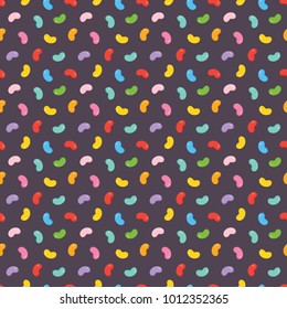 Colorful jelly beans candies seamless pattern on dark background.