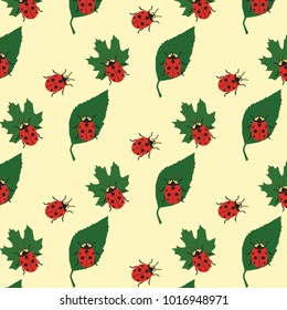 colorful ladybug and green leaves on a light background