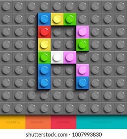 Colorful letter R from building lego bricks on gray lego background. Lego letter R