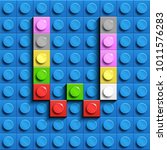 Colorful letters W of alphabet from building lego bricks on blue lego brick background. blue lego background. 3d letters W. Realistic letters