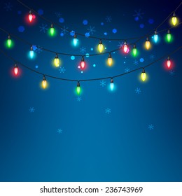 Colorful of light bulb on a blue background and snowflakes. A vector illustration.