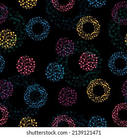 Colorful lights seamless background. Irregular Hand Drawn Simple Dotted Print. Tiny Polka Dots Isolated on a Light Pink Background.