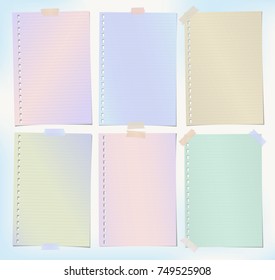 Colorful lined notebook, notepad sheets, note paper for text or message stuck with sticky tape.
