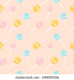 Colorful lollipops on pastel background in flat style design. Seamless background with cute candy.