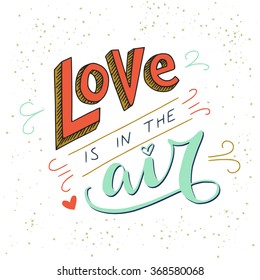 Colorful 'Love is in the air' hand lettering inspirational quote. Can be used as wedding element or save the date card design.