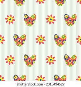 Colorful love heart vector seamless pattern in boho style. Bright floral hearts and flowers on striped green backdrop. Folk art botanical geometric repeat. For cottage decor, giftwrap, packaging