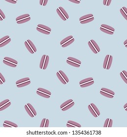 Colorful macarons seamless pattern. Colorful macarons cake. Cute donuts isolated on light blue background. Delicious desserts. Fresh bakery. Can be used in food industry for wallpaper.