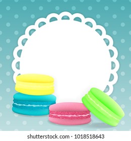 Colorful macaroons on a light blue background with tracery frame. Blanc for your design. realistic style. vector illustration.