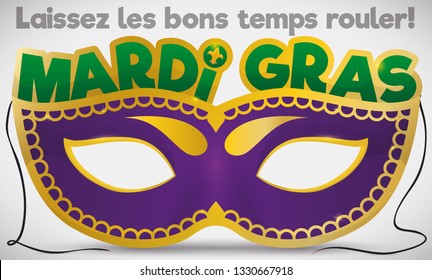 Colorful mask ready to celebrate Mardi Gras carnival in New Orleans and traditional greeting message (written in French, meaning: "Let the good times roll!").