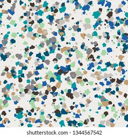 Colorful micro terrazzo pattern in blue, green, and neutral colors.  Huge random repeat.  Trendy seamless repeat vector pattern.